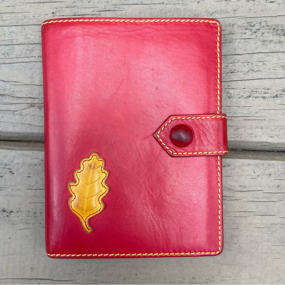 Ines De La Fressange Paris red leather wallet with yellow leaf stitched